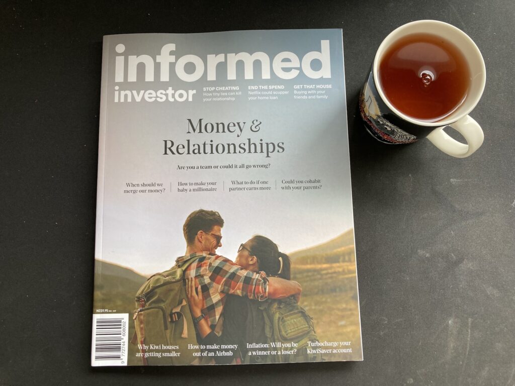Informed Investor magazine with a cup of tea next to it